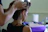 woman in black tank top holding her hair