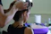 woman in black tank top holding her hair
