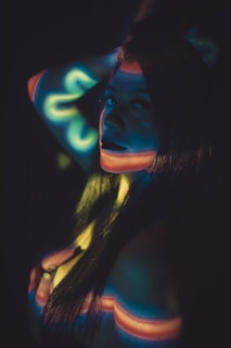 An influencer engaging with their audience live, framed by glowing neon outlines that emphasize energy and connection