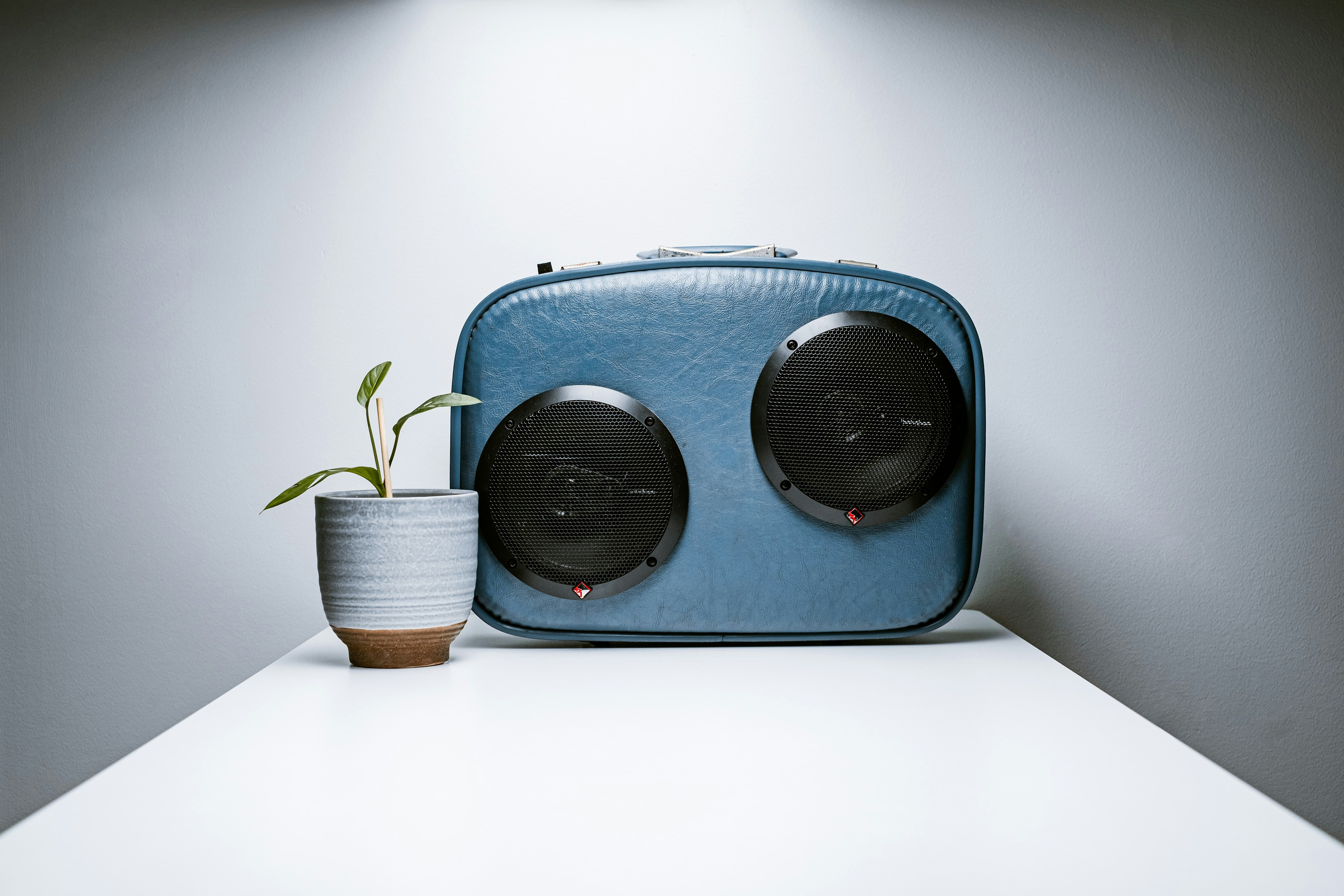 blue and brown radio on white table