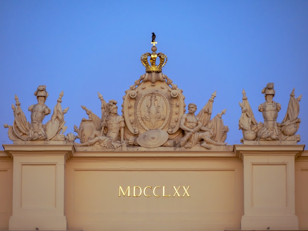 white concrete statues under blue sky during daytime