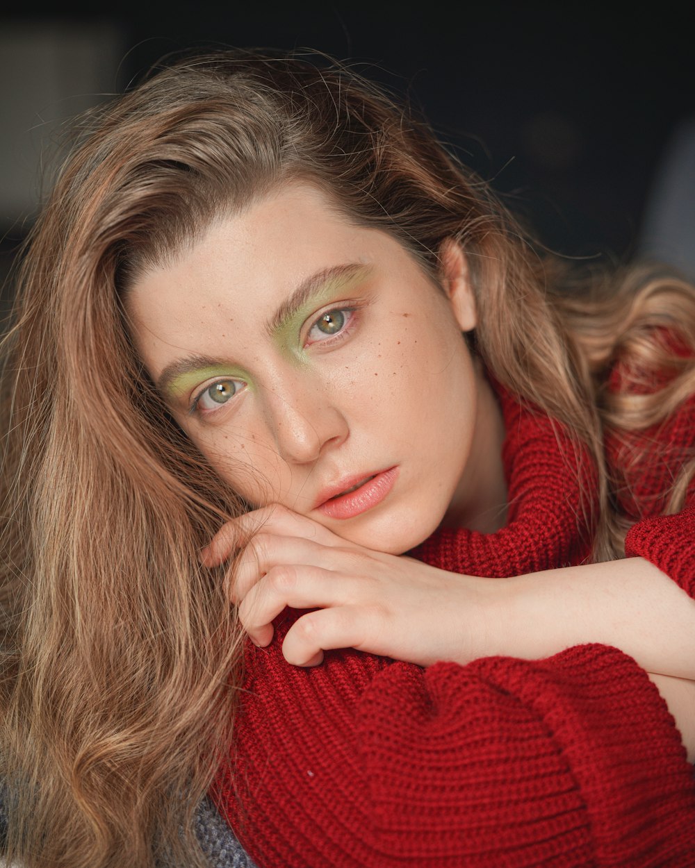 woman in red knit sweater