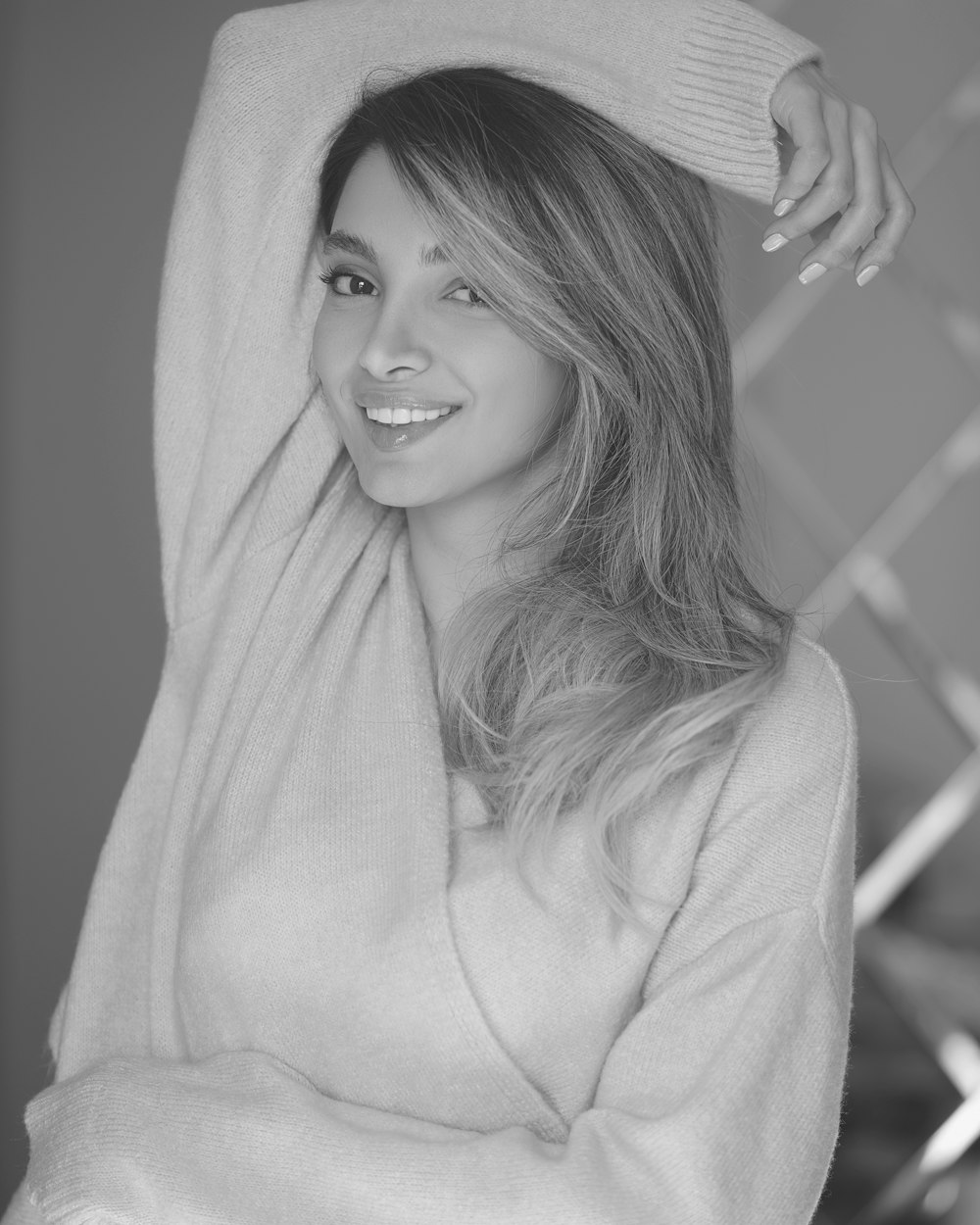 grayscale photo of woman in long sleeve shirt