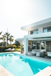 white concrete building with swimming pool