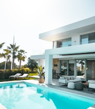 white concrete building with swimming pool