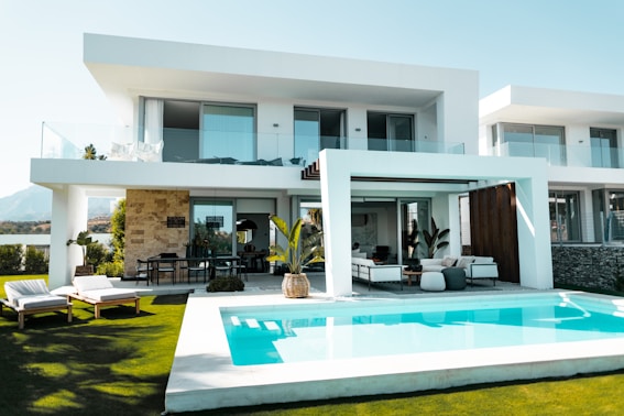 A simple modern Bangalow with swimming pool and green landscape. 