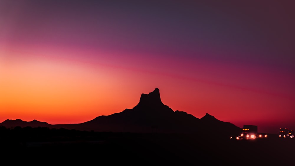 silhouette of mountain during sunset