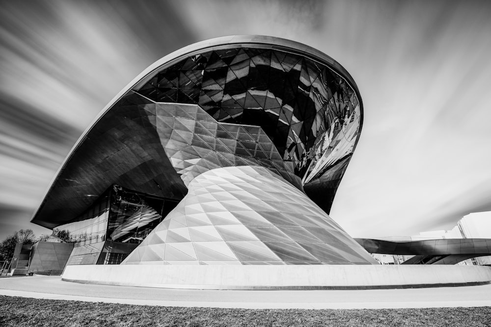 grayscale photo of glass building