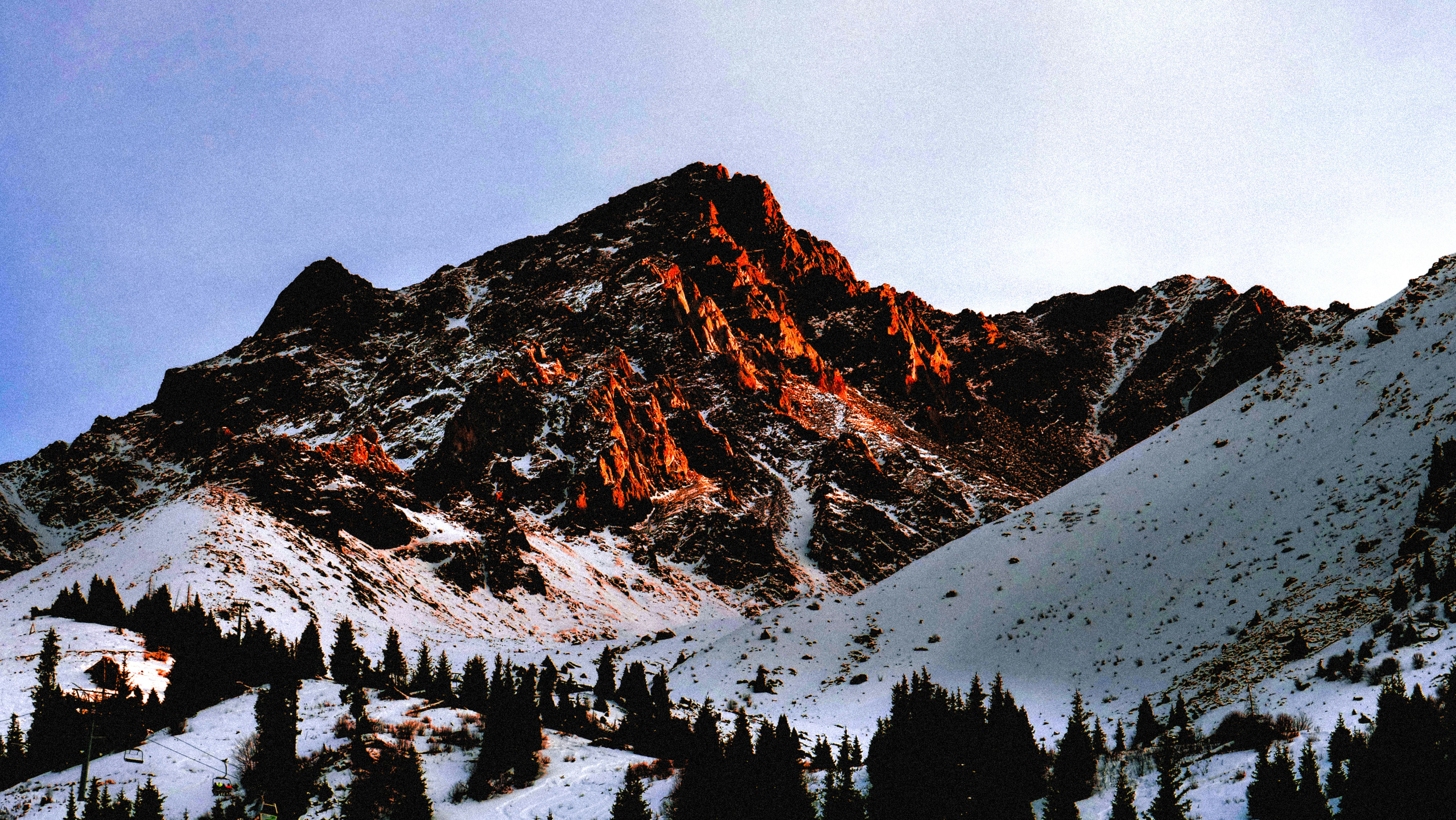 snow covered mountain during daytime