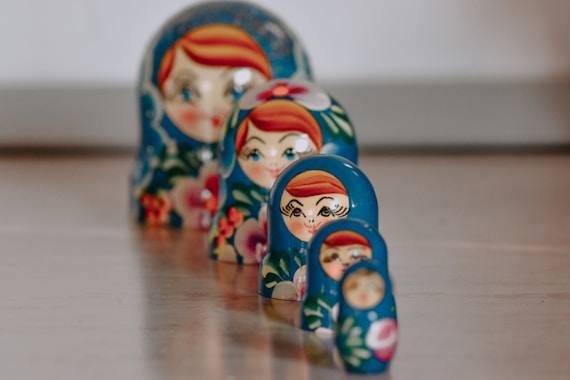 red blue and yellow ceramic figurine