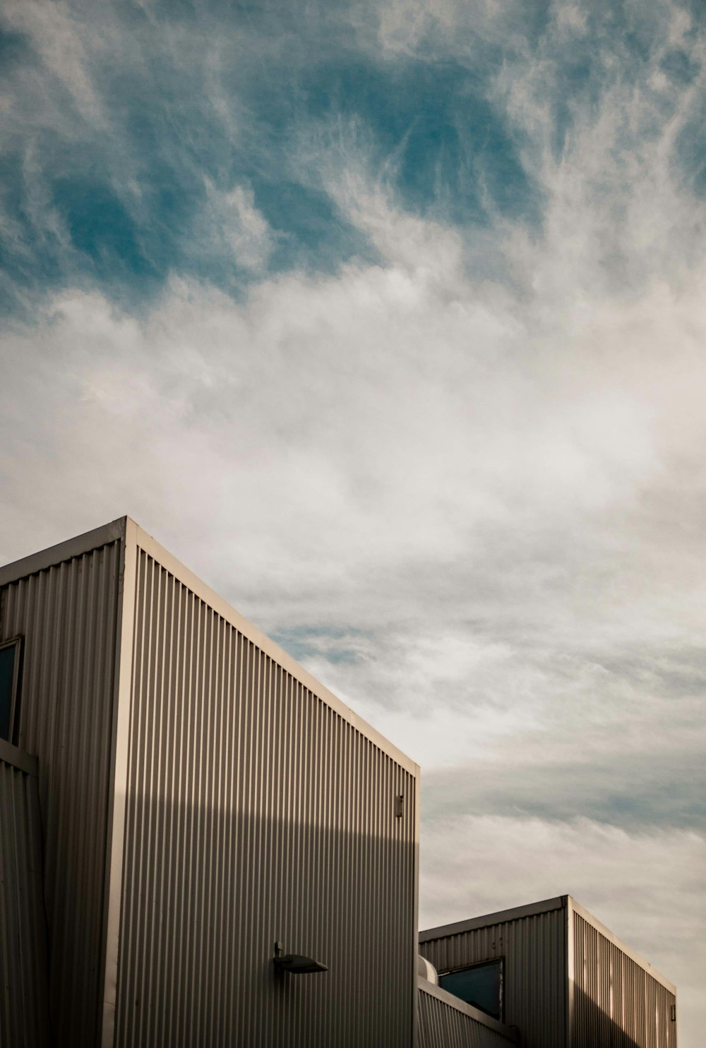 white and gray building under blue sky during daytime