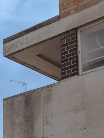 Close-up of clean building materials including concrete, glass, and brick surfaces.