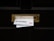 A black door with a brass mail slot containing two pieces of mail. Above the slot, a sign reads 'No Free Newspapers or Junk Mail'. The mail is protruding from the slot and includes text and images of people.