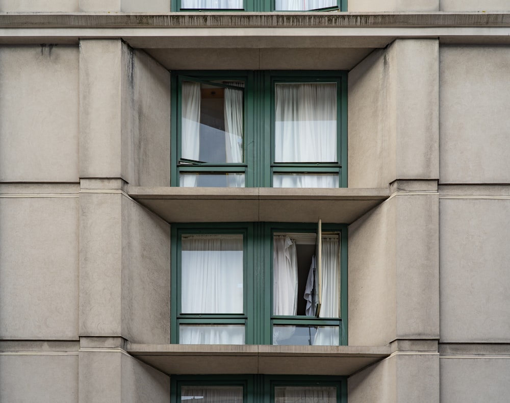 brown concrete building with blue window