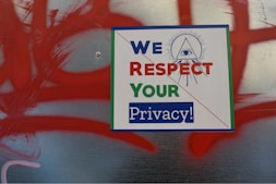 green and white book on red and white textile