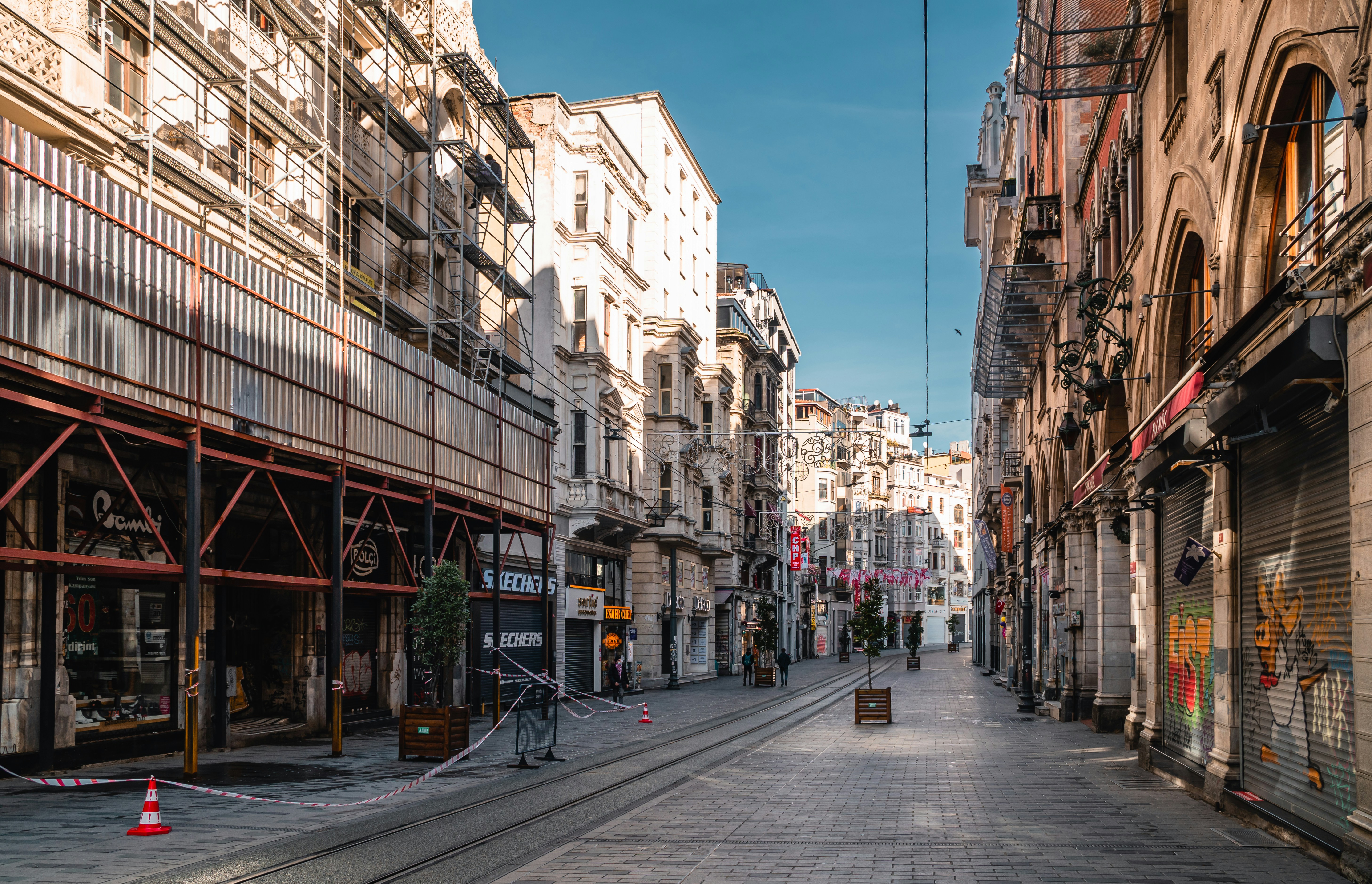 white concrete building beside road during daytime, Istiklal Street in Istanbul, Turkey