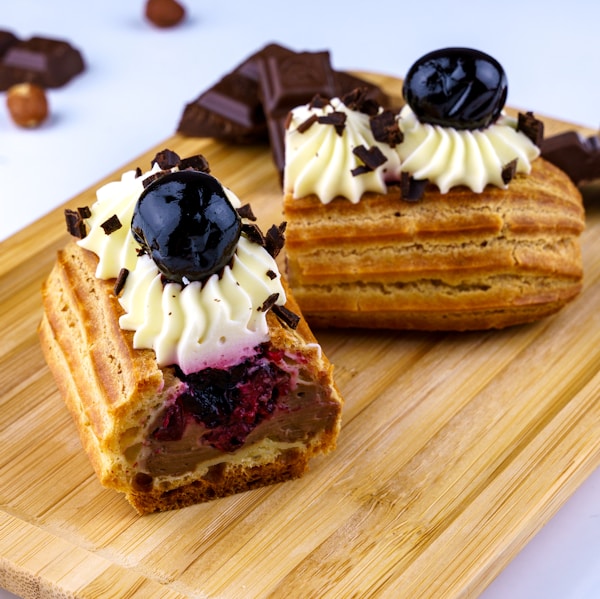 brown and white cake on brown wooden board