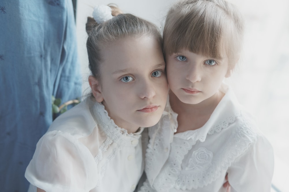 2 girls in white dress shirt