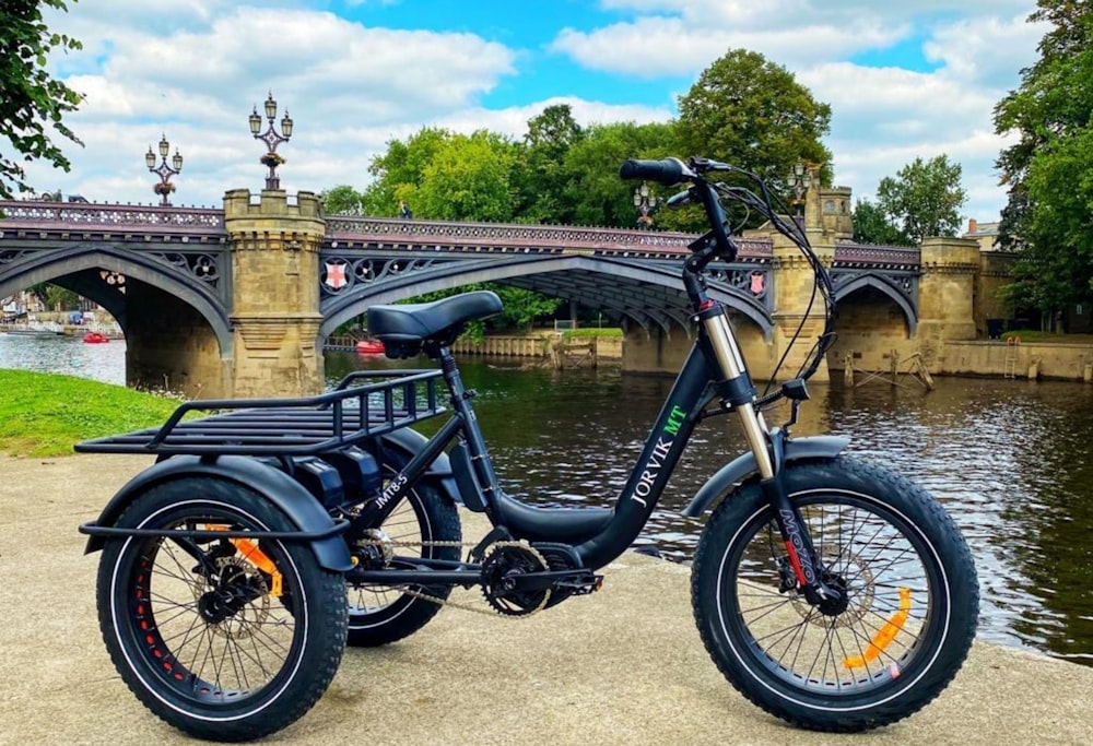 black and gray bicycle near brown concrete bridge during daytime