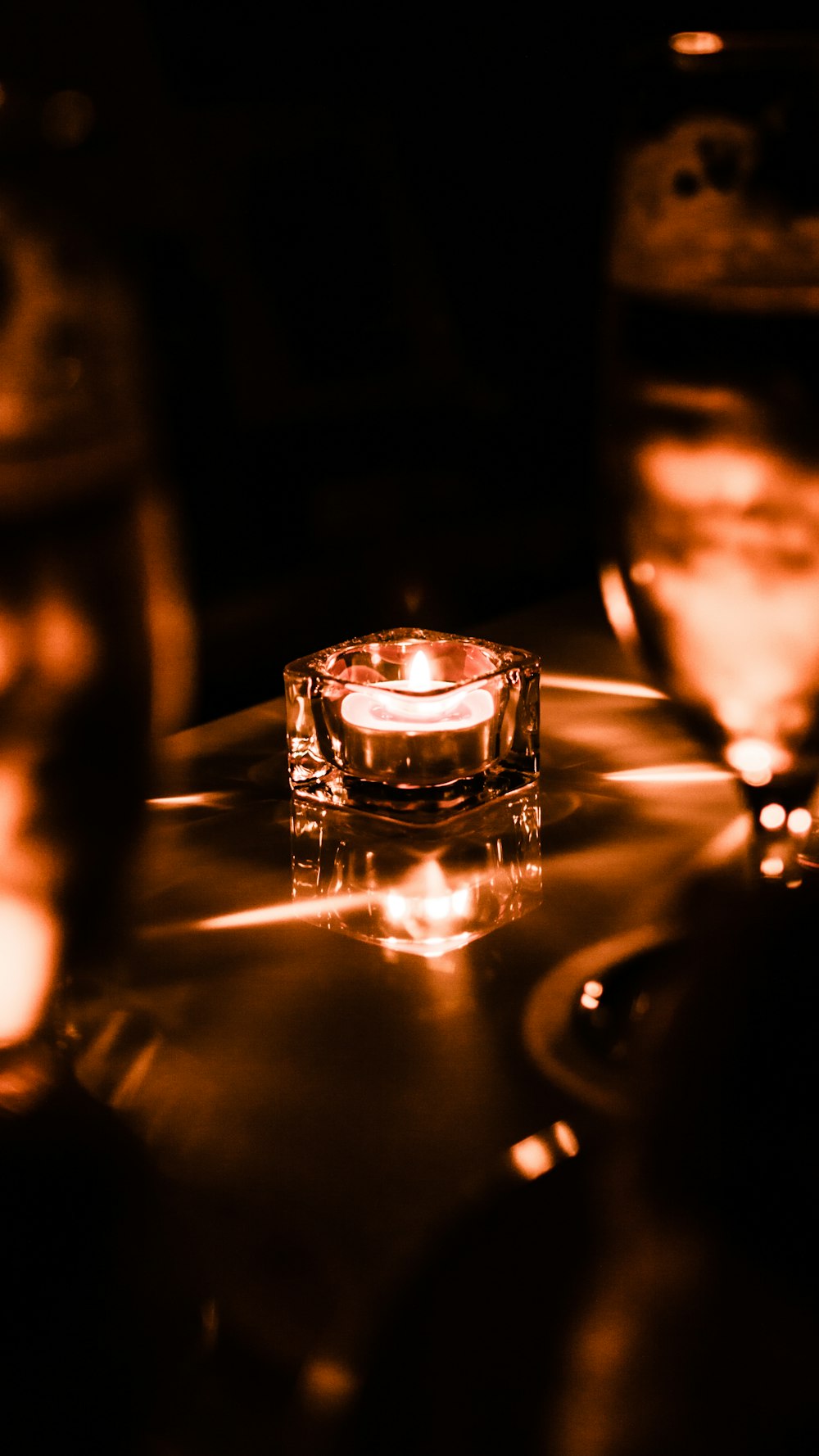 clear glass candle holder on table