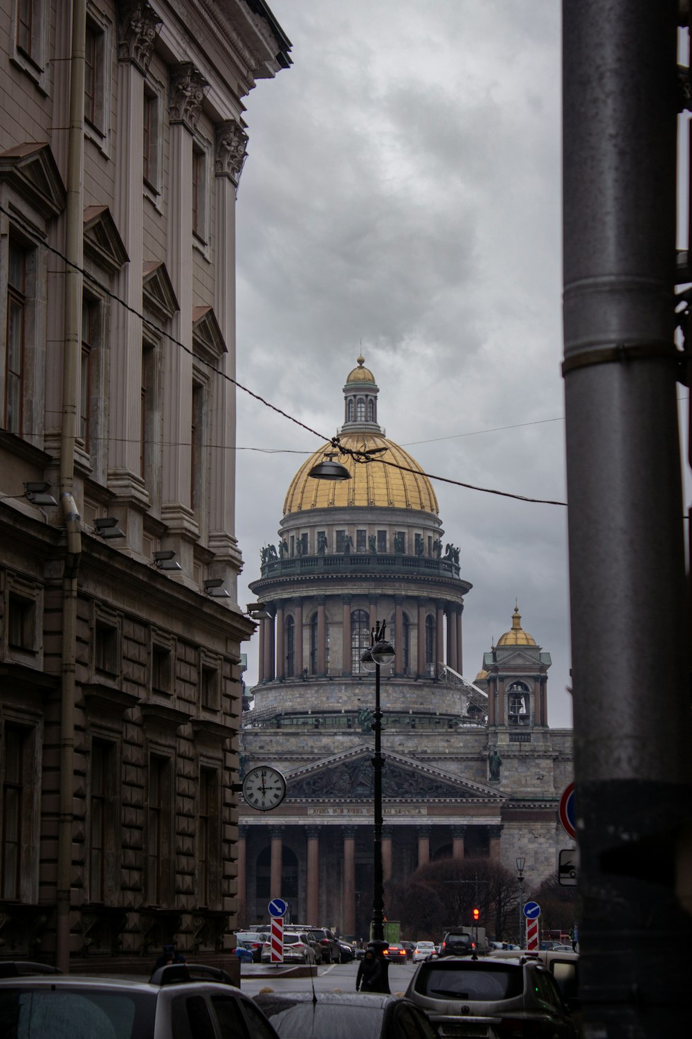 brown and black dome building under white clouds during daytime
