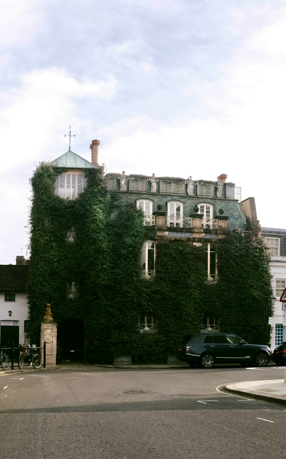 green trees near brown concrete building during daytime