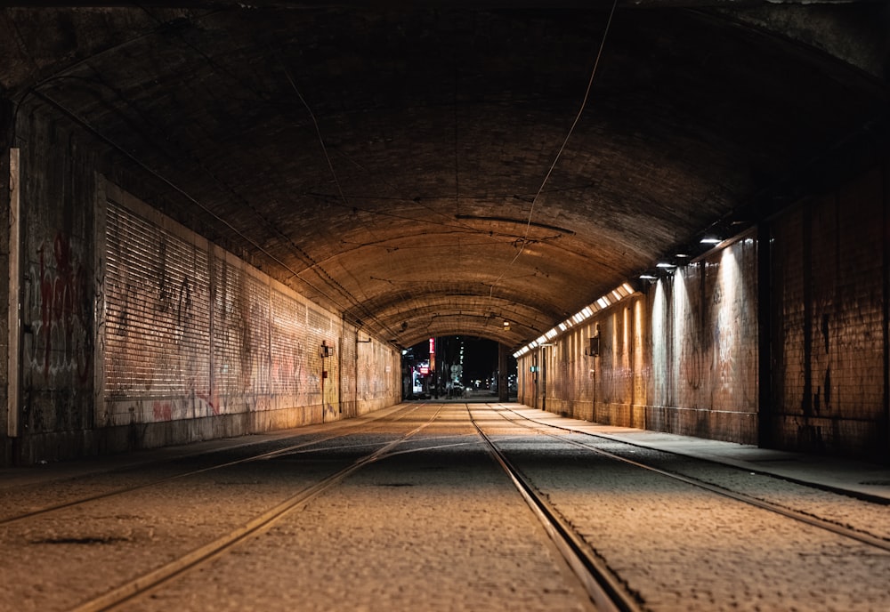 empty tunnel with lights turned on during daytime