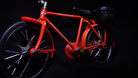 Sleek electric bike for kids in vibrant colors displayed with price tags.