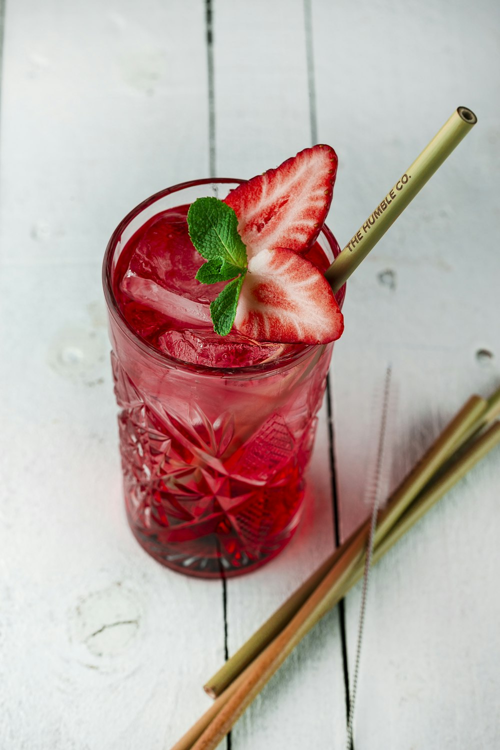 strawberry juice in clear drinking glass