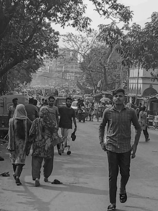 A vibrant street scene featuring men wearing casual and formal attire.