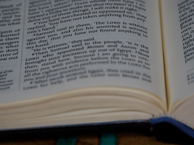 An open book displaying a section of text from a printed page. The text is formatted into columns, and the focus remains on a specific passage. The page edges have a slight curve, indicating the book is not entirely flat.