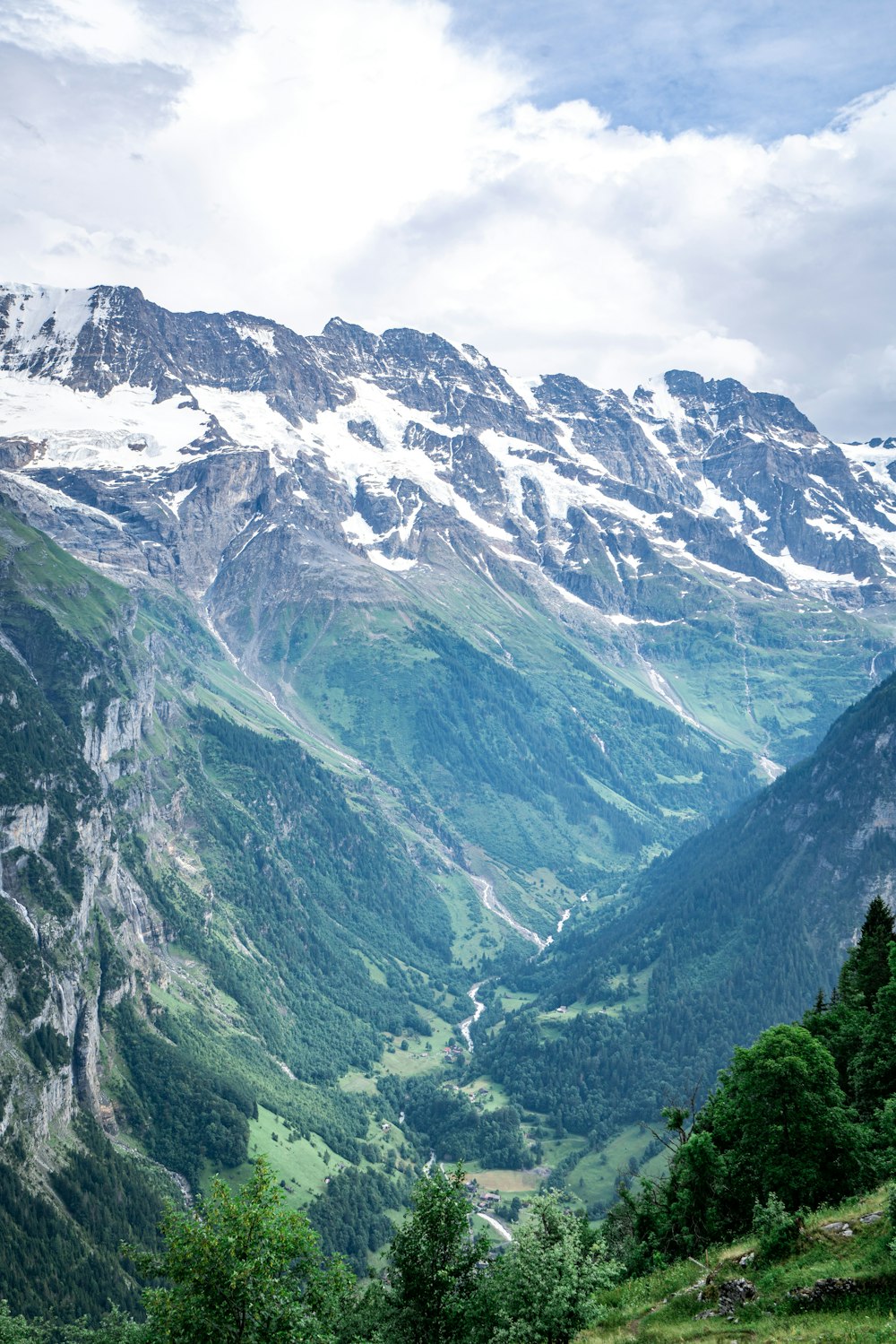 green and white mountains under white sky during daytime