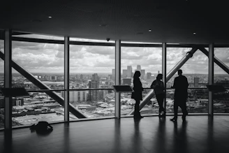 silhouette of people walking on the bridge