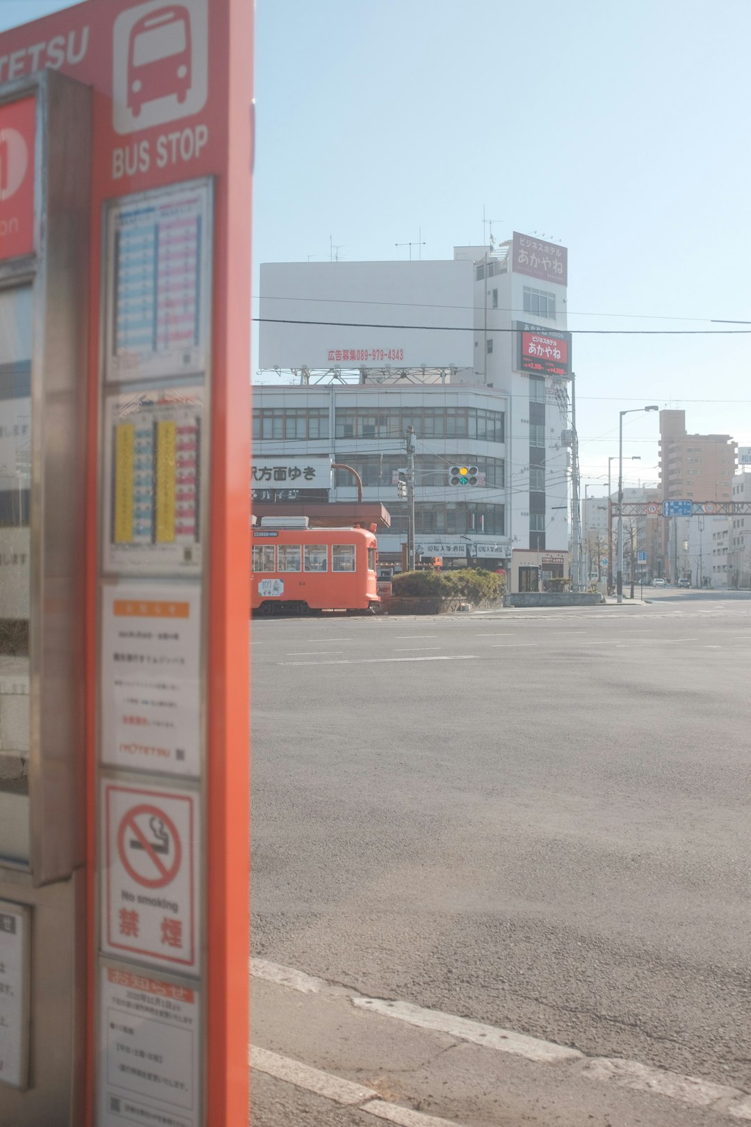 red and white signage on gray concrete road