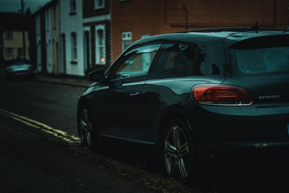 black car parked on the side of the road