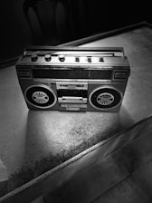 Vintage cassette player being carefully restored on a workbench