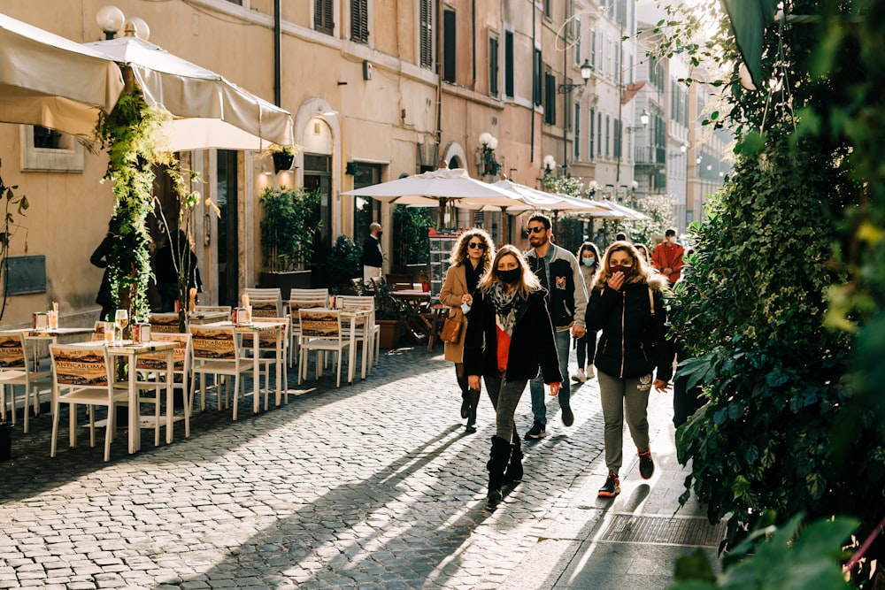 people walking on sidewalk during daytime