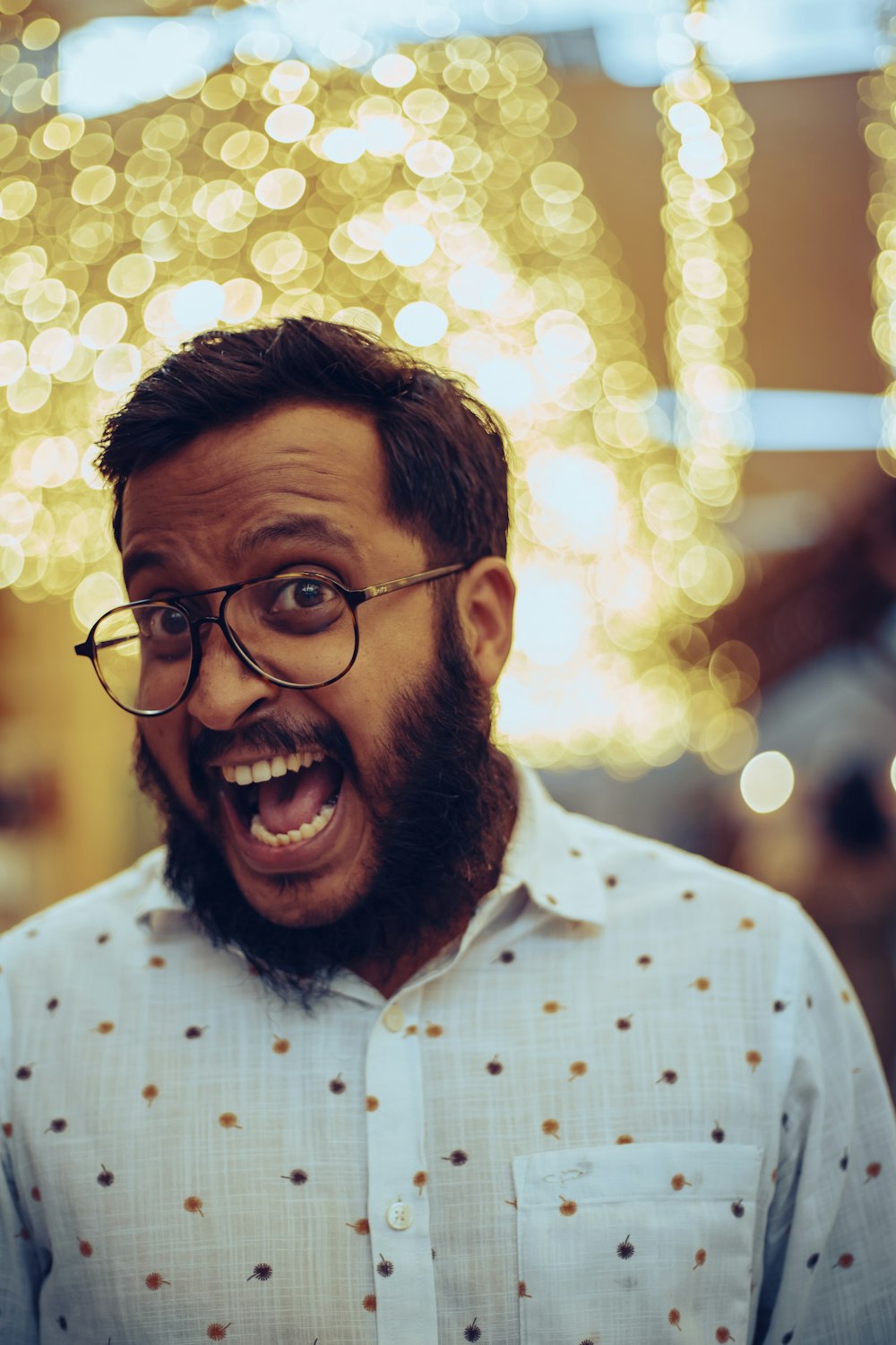 man in white and black checkered button up shirt smiling