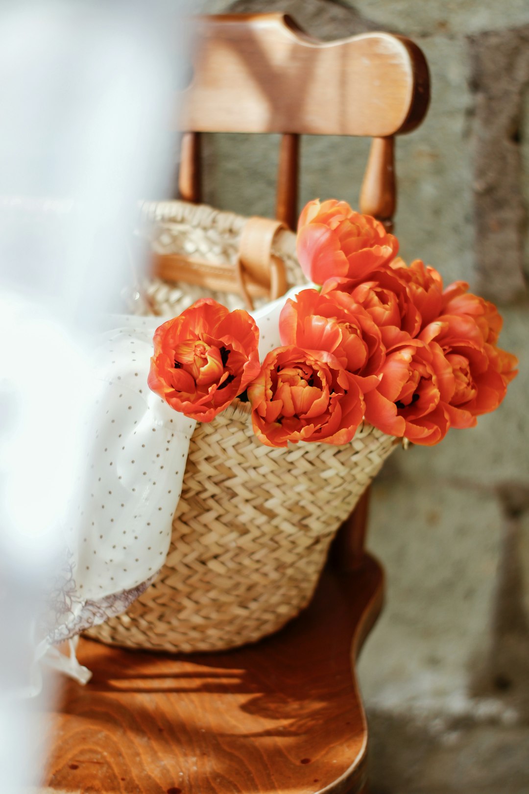 pink roses in brown woven basket