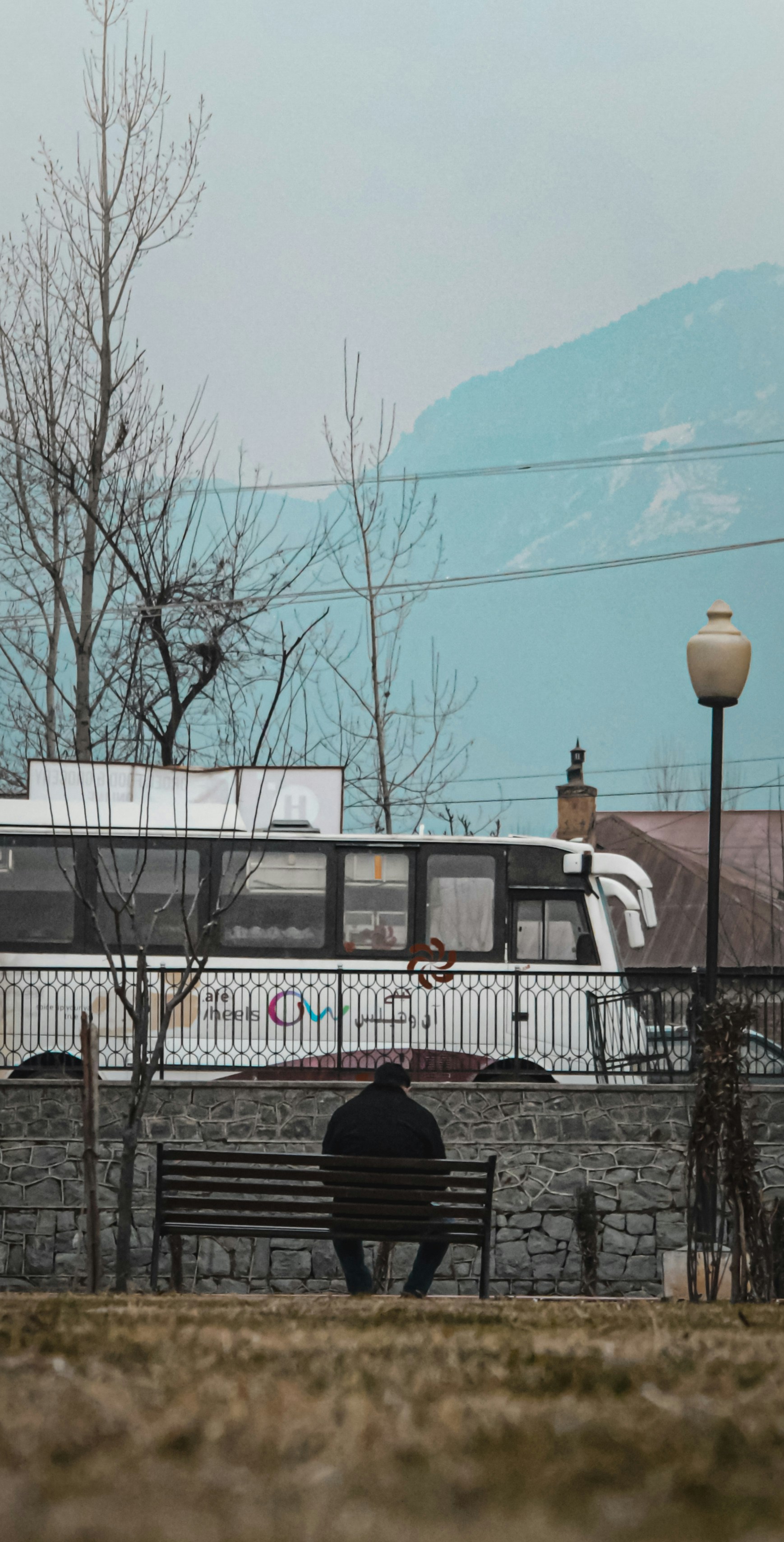 white and blue bus on road during daytime