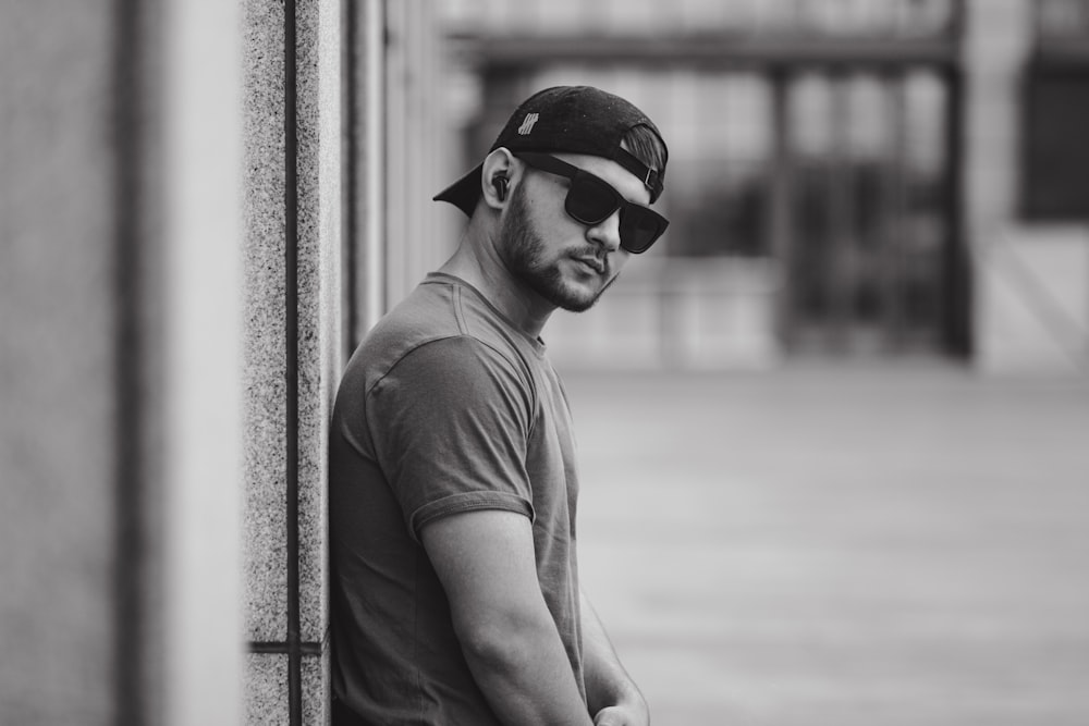 man in gray crew neck t-shirt and black sunglasses