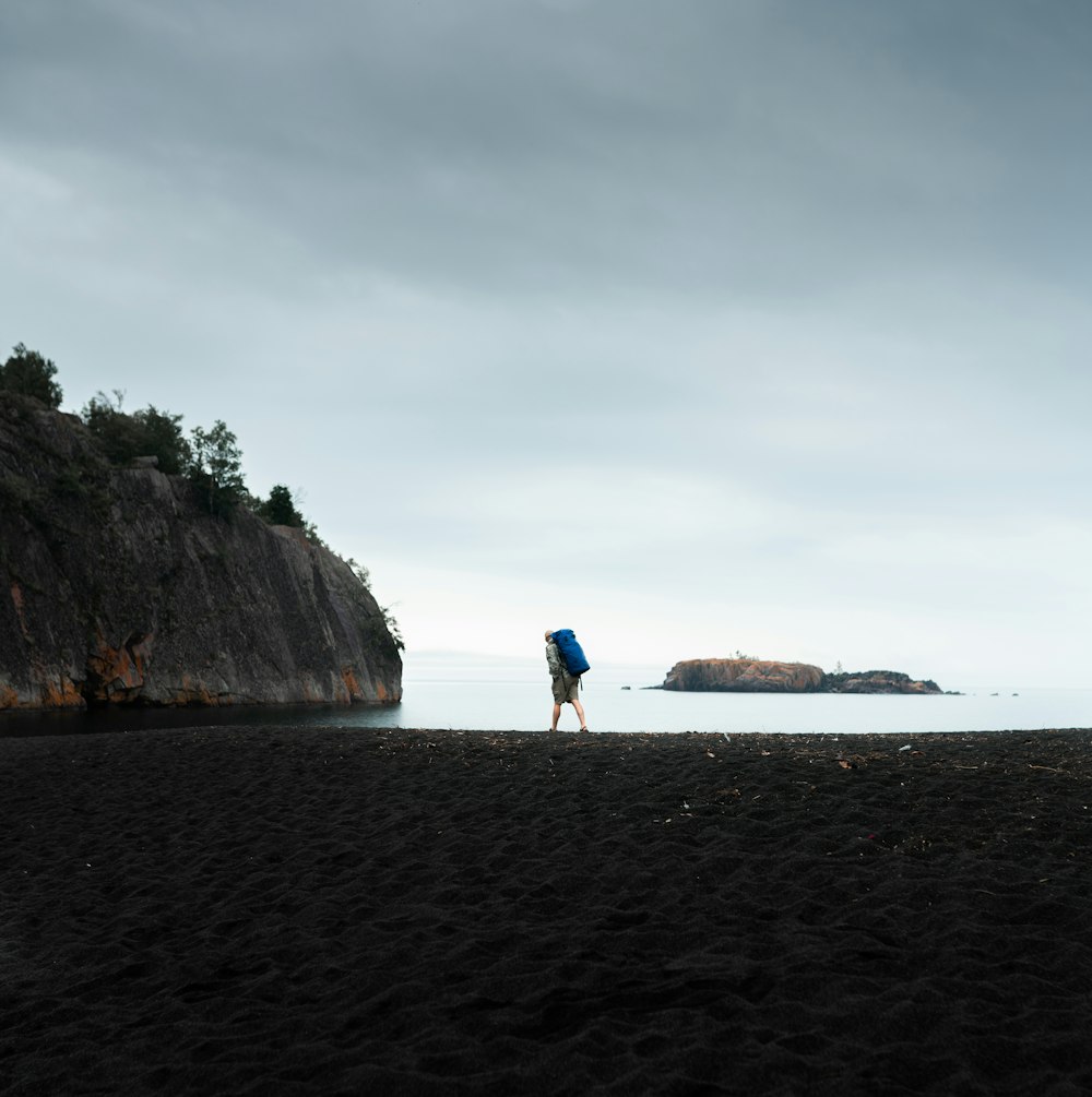 2 person walking on beach shore during daytime