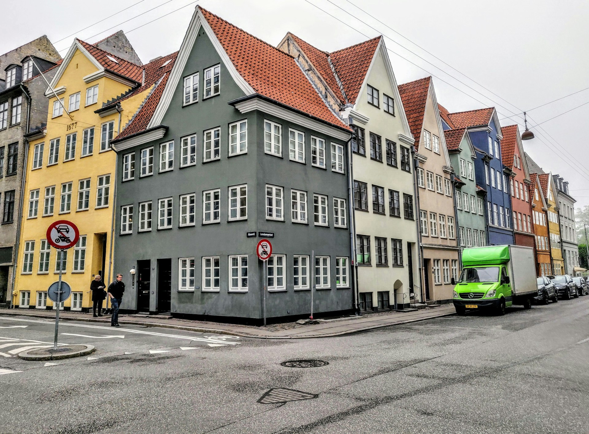 woman wearing yellow long-sleeved dress under white clouds and blue sky during daytime