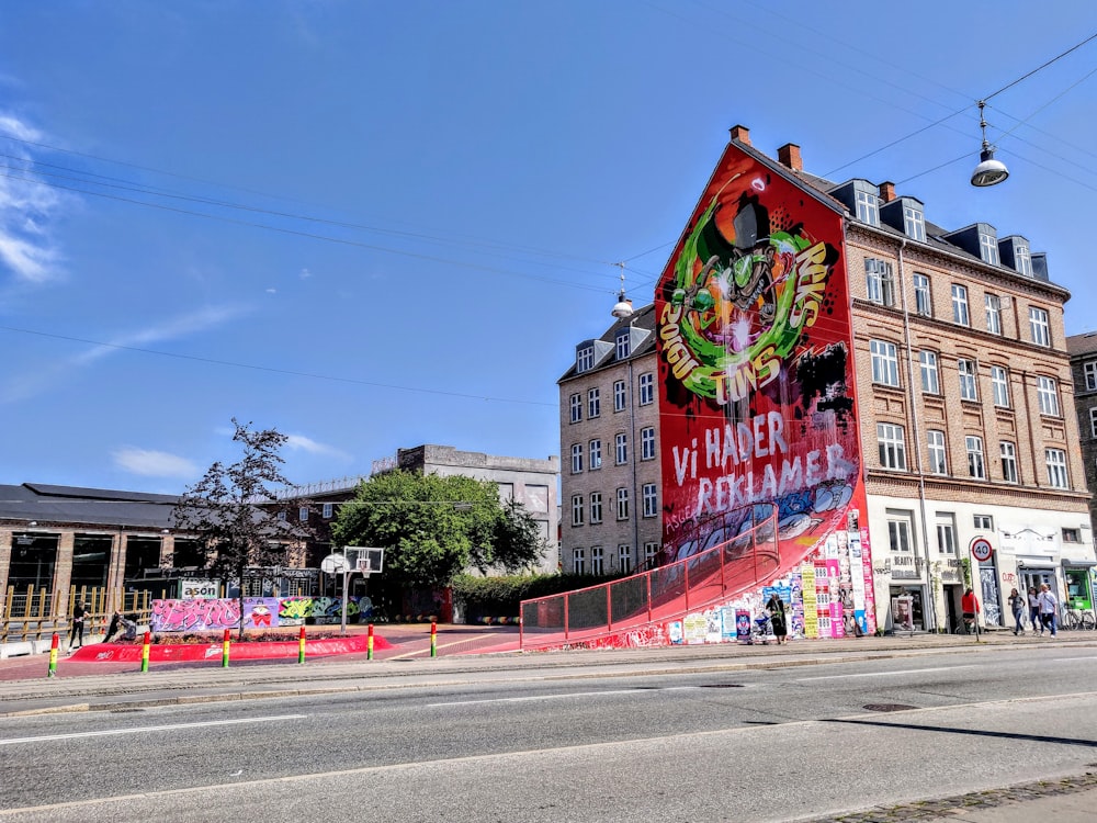 brown concrete building with graffiti art during daytime