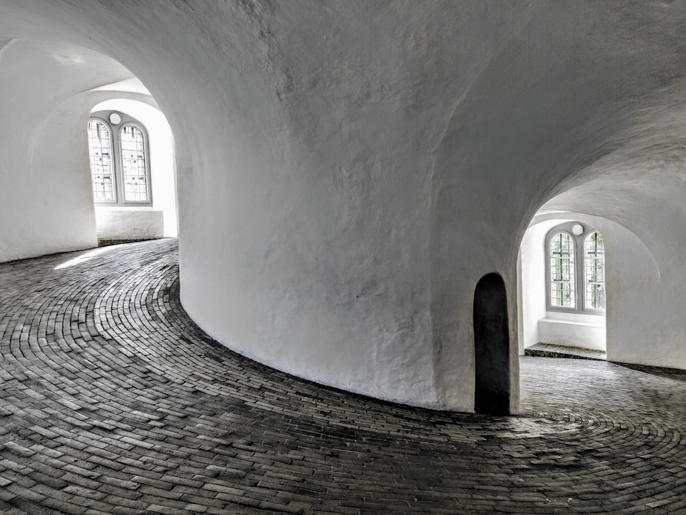 gray concrete hallway with white wall