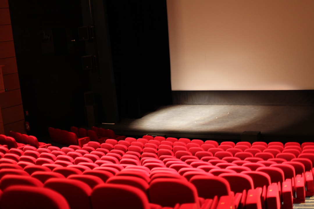 red chairs in front of white projector screen