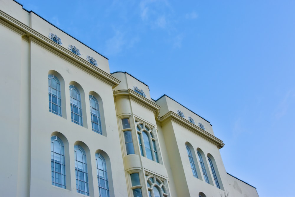 white concrete building under blue sky during daytime