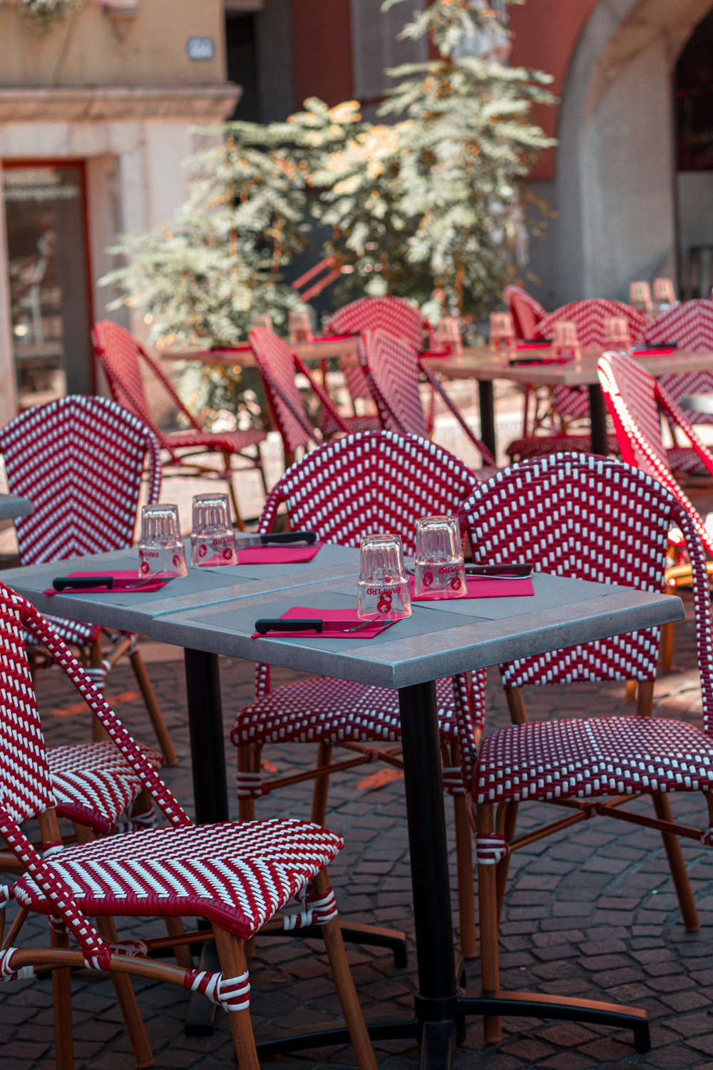 blue table with red and white chairs