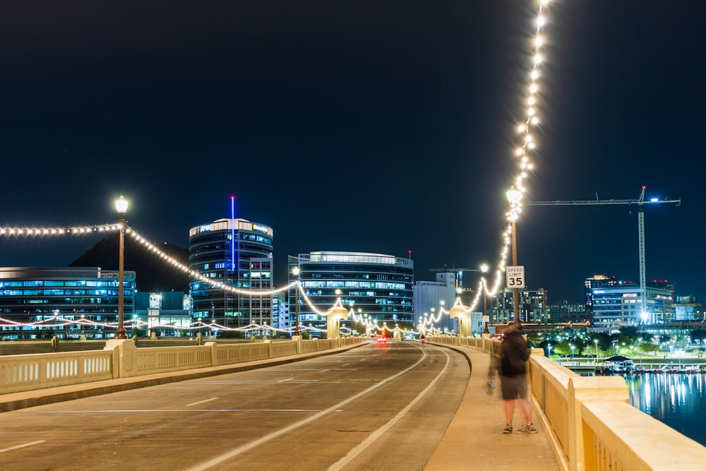 people walking on street during night time