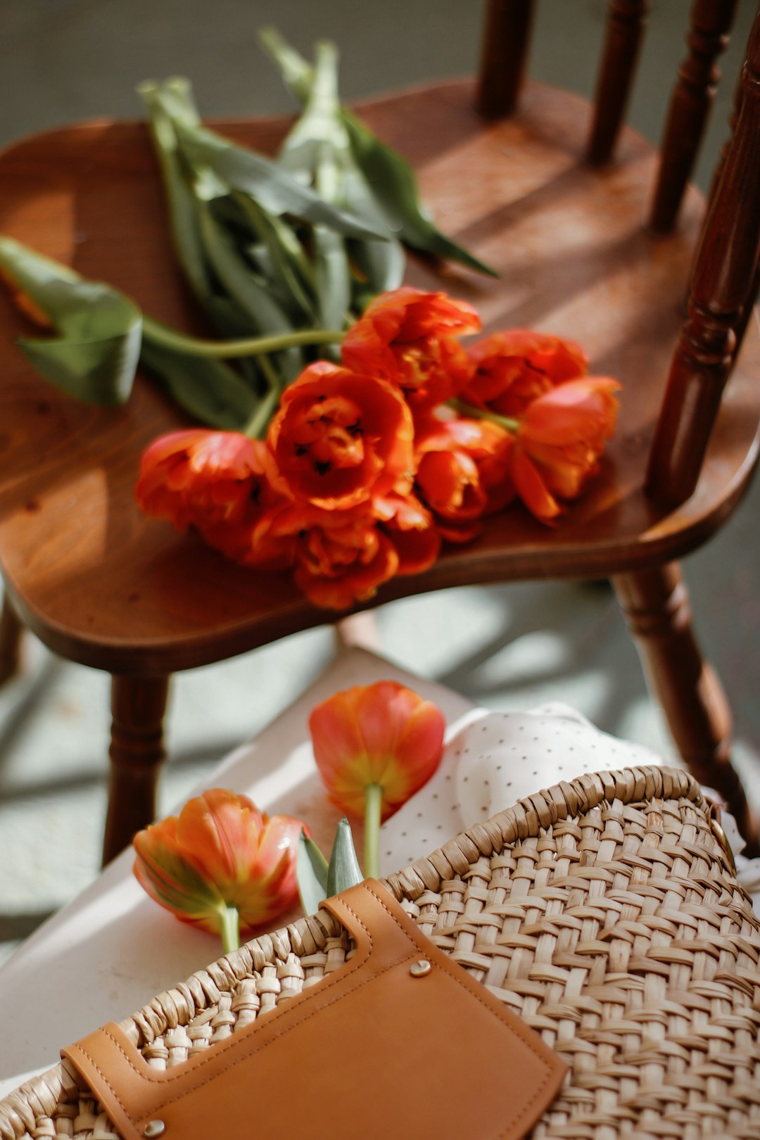 red flower on brown wooden table